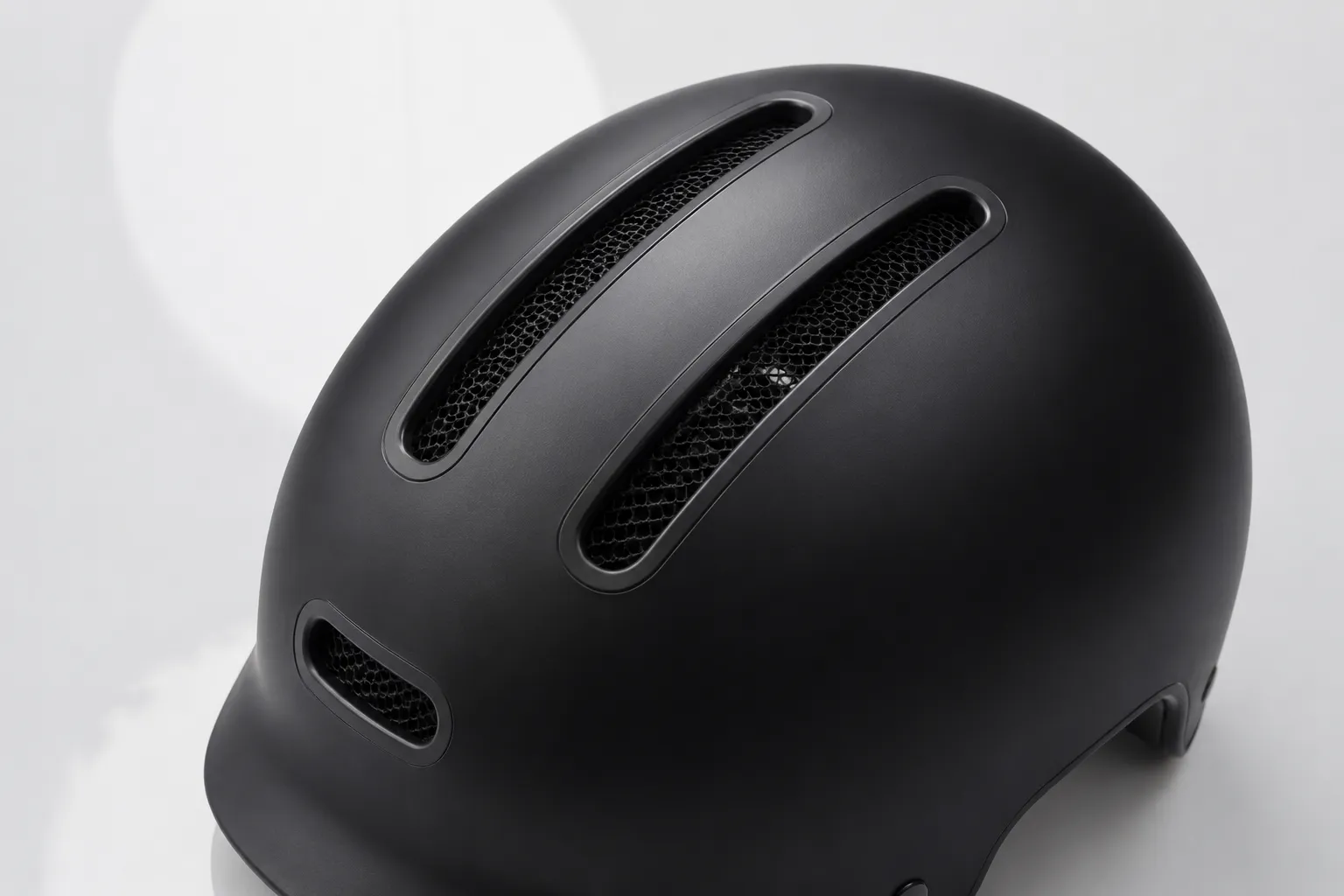 Ventilation channels on a matte black e-scooter helmet